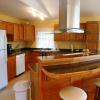 The Spacious Upstairs Kitchen with Bar for eating 